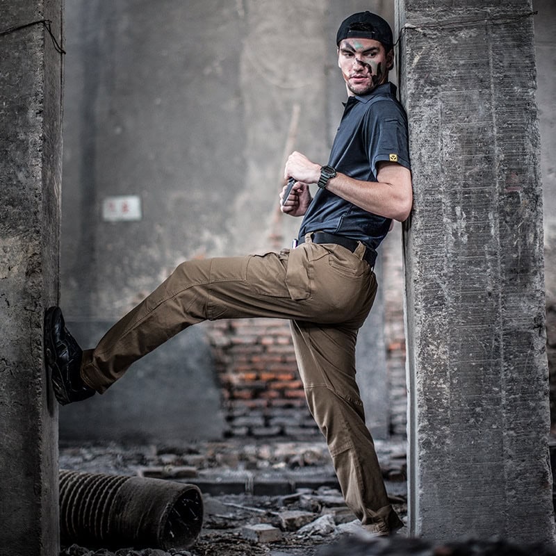 Operator wearing the coyote brown Onken IX9 lightweight tactical pants, demonstrating their athletic fit and superior mobility for active professional use.
