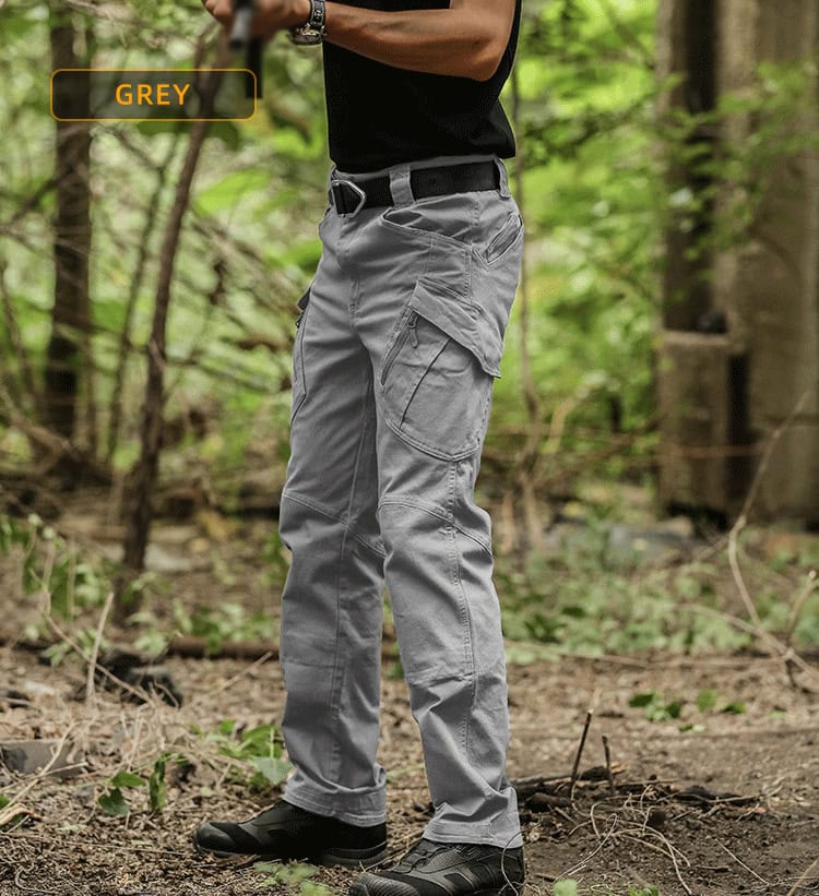 A professional wearing the grey Onken IX9 lightweight tactical pants, showcasing the modern, low-profile design suitable for urban and covert operations.