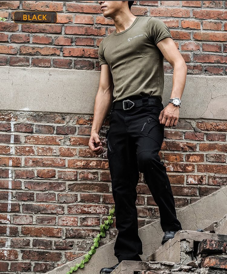 Man wearing the black Onken IX9 lightweight tactical pants in an urban setting, ideal for plainclothes law enforcement and security details.