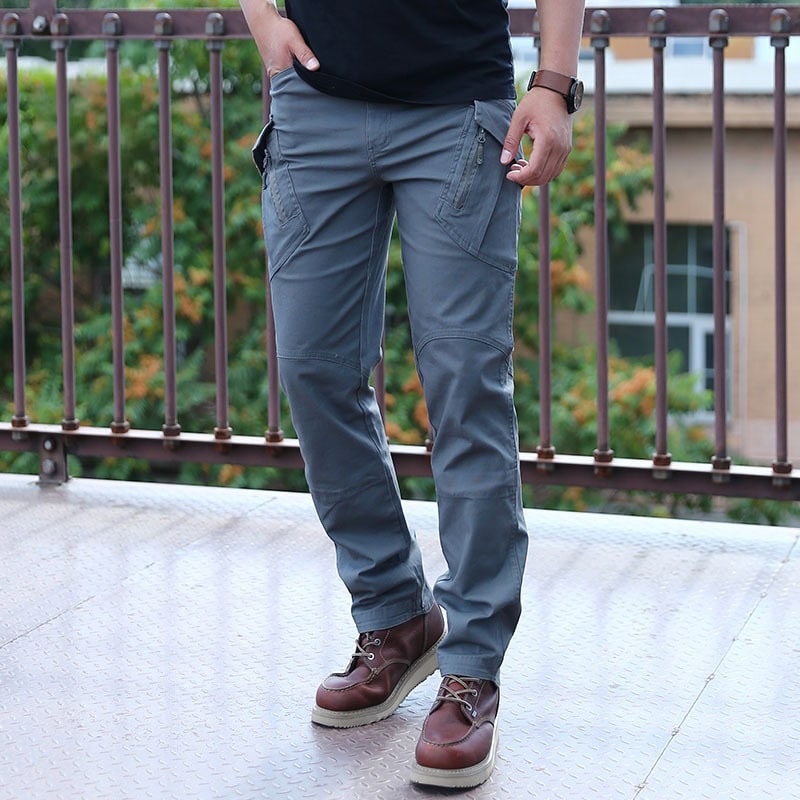 A professional wearing the grey Onken IX9 lightweight tactical pants, showcasing the modern, low-profile design suitable for urban and covert operations.