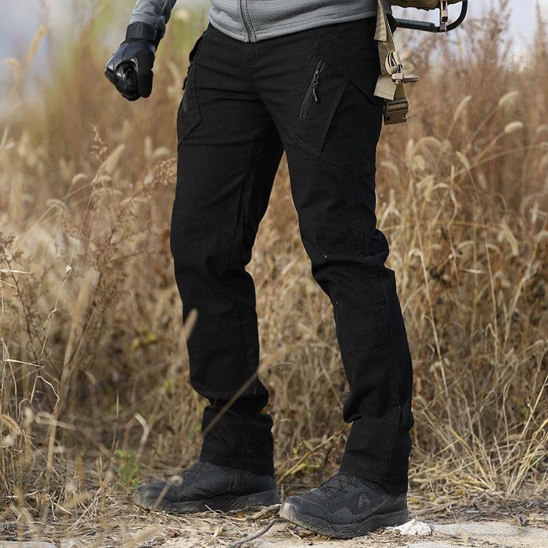 Man wearing the black Onken IX9 lightweight tactical pants in an urban setting, ideal for plainclothes law enforcement and security details.
