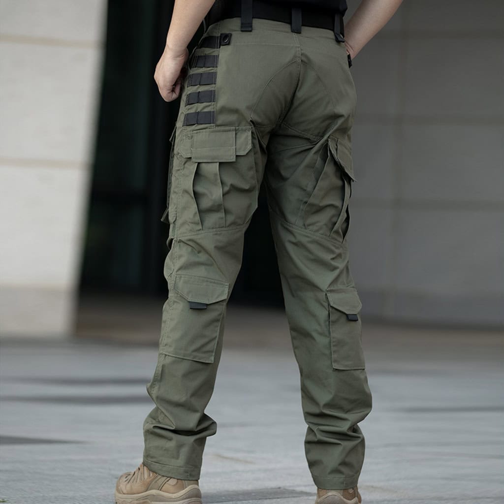 A professional wearing the olive green Onken Beetle durable tactical pants, demonstrating their classic, relaxed fit and rugged appearance.
