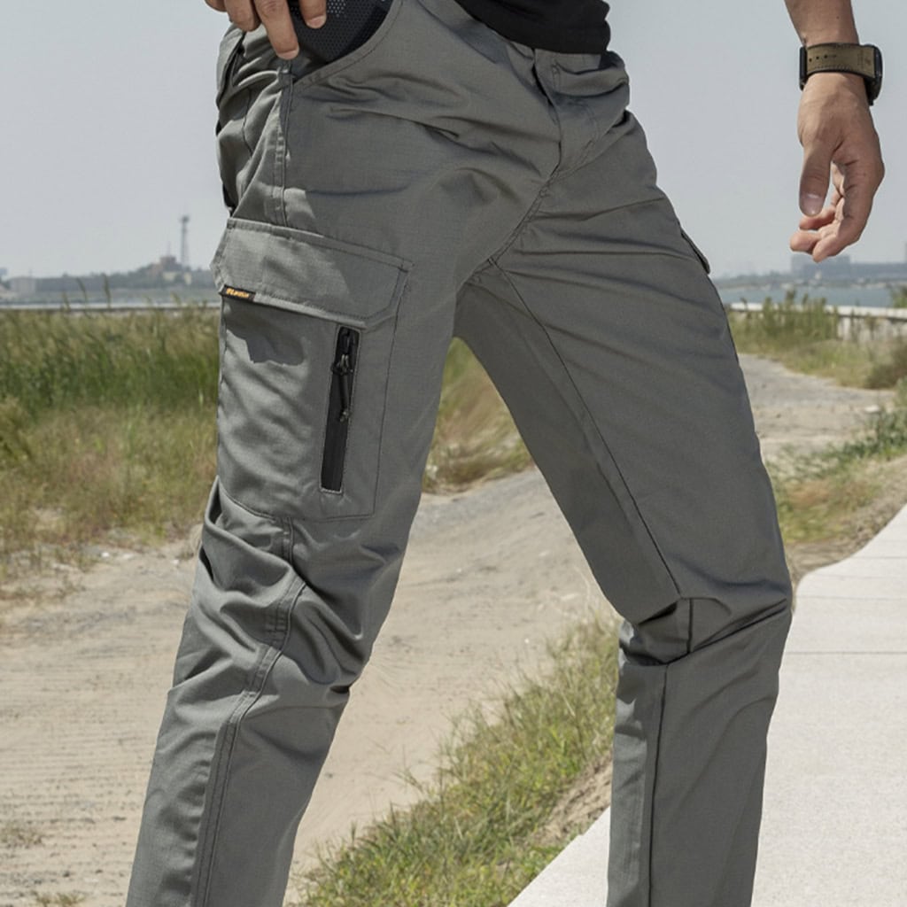 Operator wearing the grey Onken tactical jogger pants, demonstrating their superior mobility and athletic fit during dynamic movement.