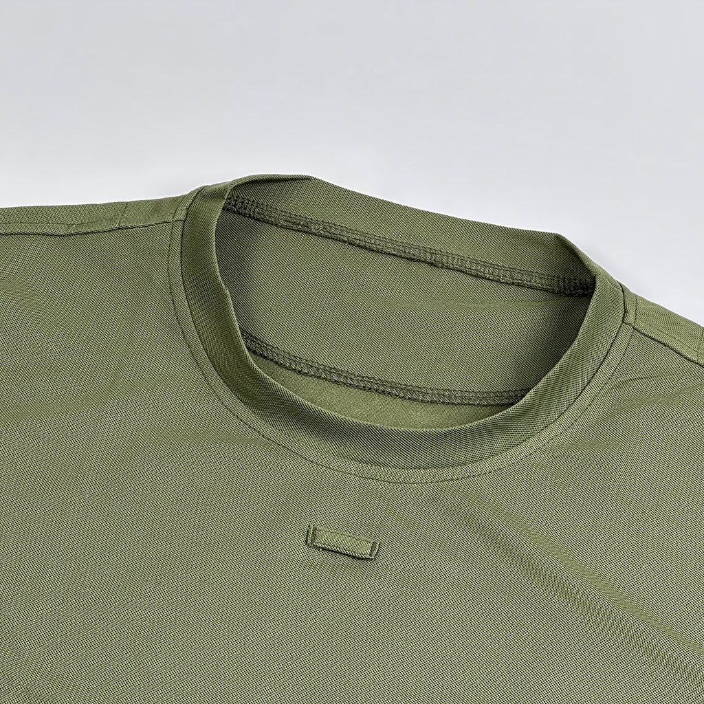 Close-up of the durable, shape-retaining crew collar on the performance tactical t-shirt, featuring a tagless label for enhanced comfort.