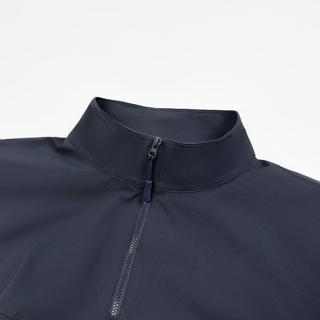 Navy blue flame retardant combat shirt, part of a tactical FROG suit, with shoulder pockets.