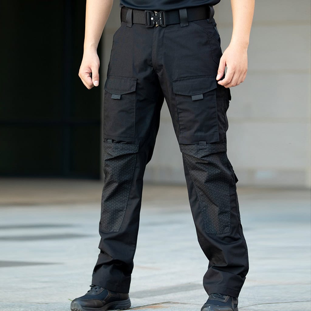A professional wearing the black Onken Beetle durable tactical pants, a reliable and long-lasting option for police and security uniforms.