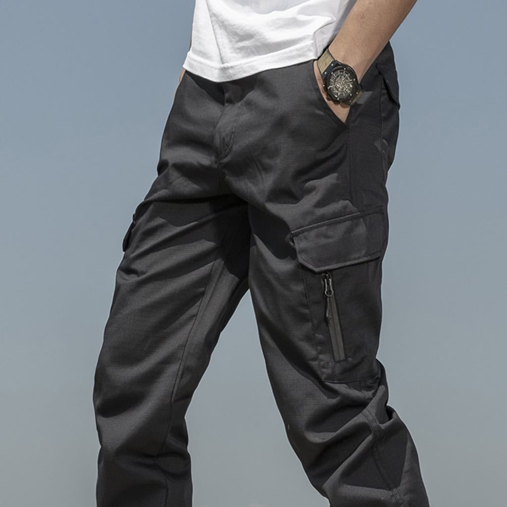 Operator wearing the grey Onken tactical jogger pants, demonstrating their superior mobility and athletic fit during dynamic movement.