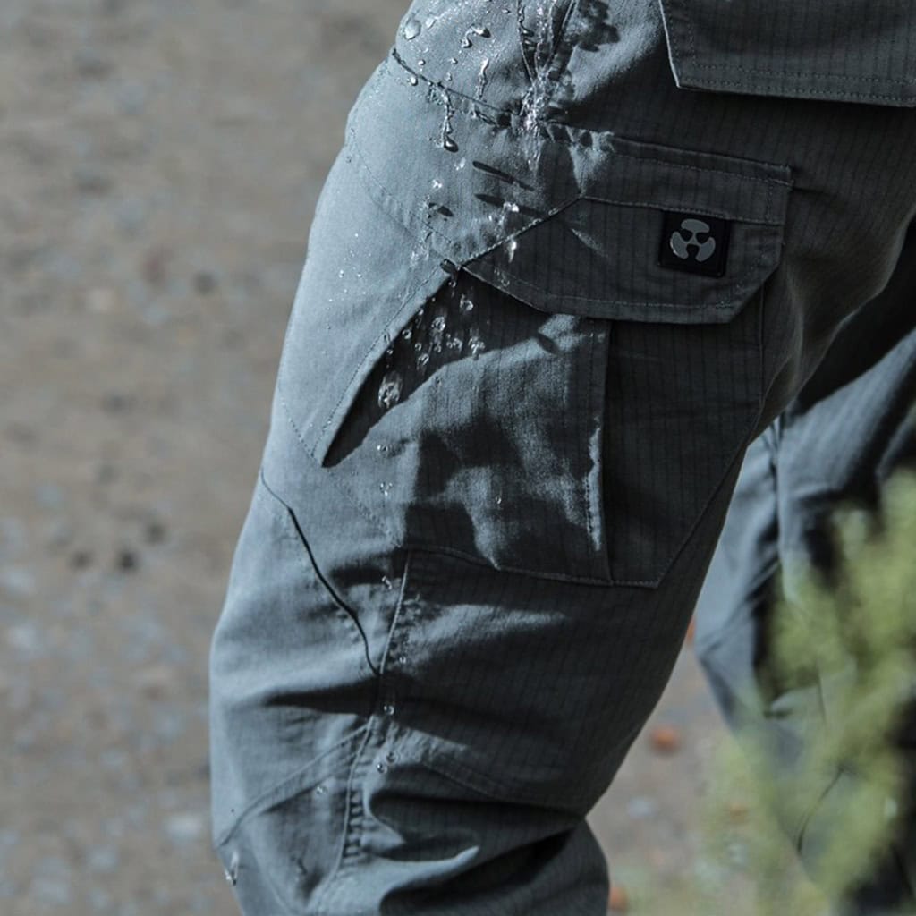 Close-up of water beading on the fabric of the Thunderbolt Gen 2 Water-Resistant Tactical Pants, demonstrating the DWR finish's performance.