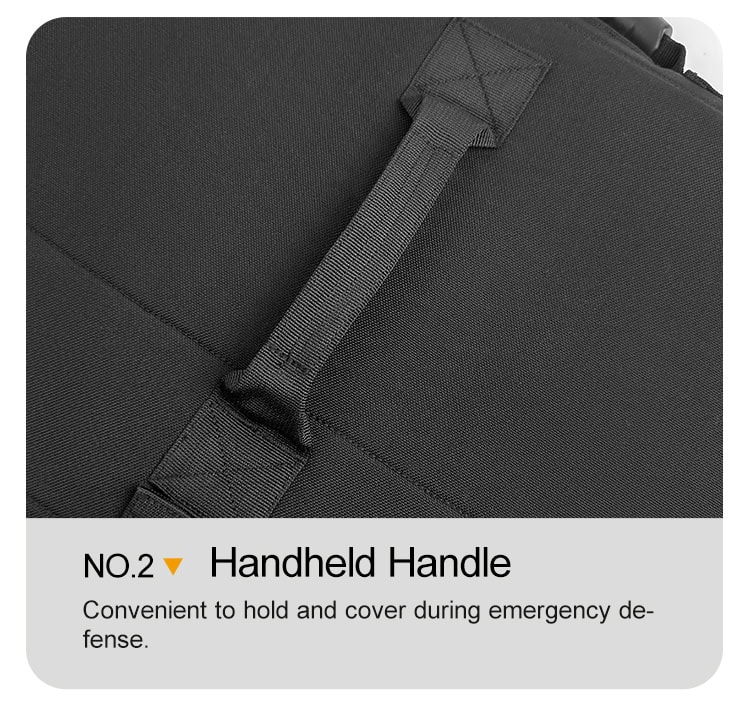 Detail of the interior handheld strap on the deployed ballistic briefcase, allowing for a secure grip during a defensive maneuver.