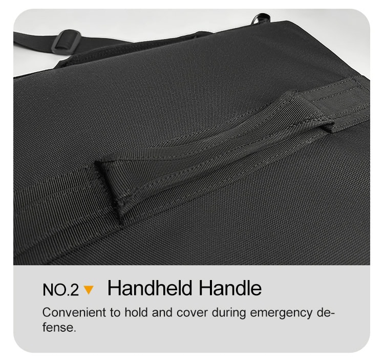 Detail of the interior handheld strap on the deployed ballistic briefcase, allowing for a secure grip to use it as a shield during an emergency.