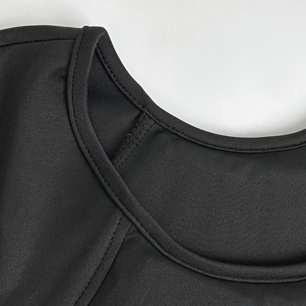 Detail of the Aegis armored t-shirt's collar design, showing the firm, comfortable stitching suitable for all-day professional wear.