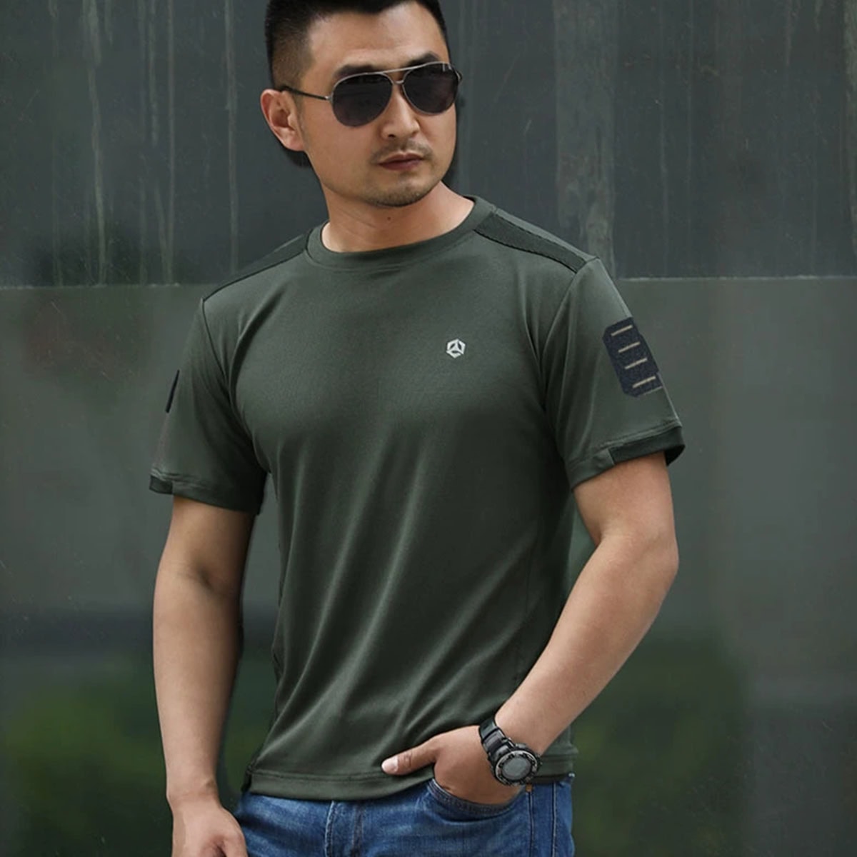 A professional wearing the olive green WHCSJ advanced moisture wicking t-shirt, demonstrating its athletic fit and superior comfort for hot weather.