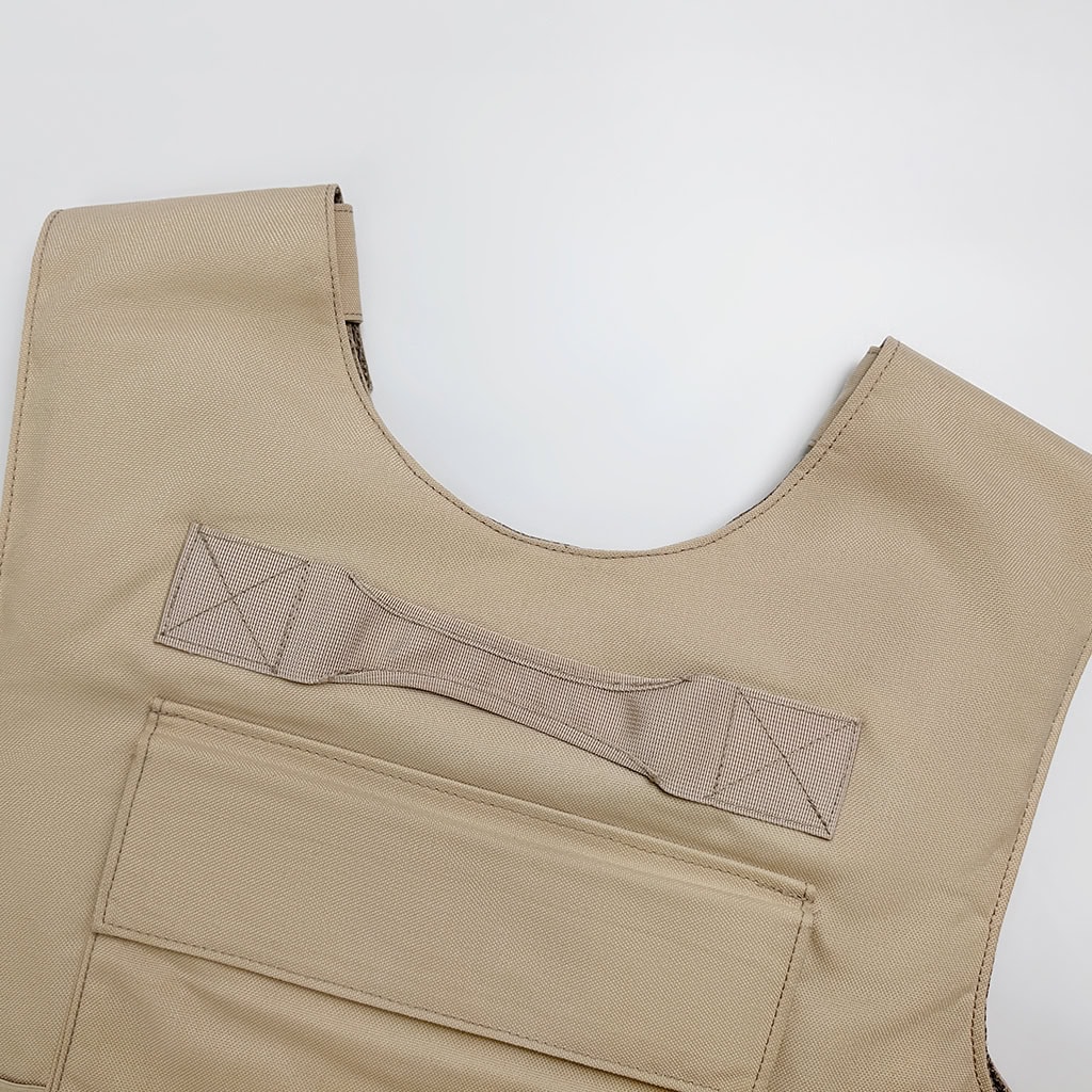 Detail of the "Press" vest's reinforced rescue drag handle, a critical safety feature for extracting personnel from dangerous situations.