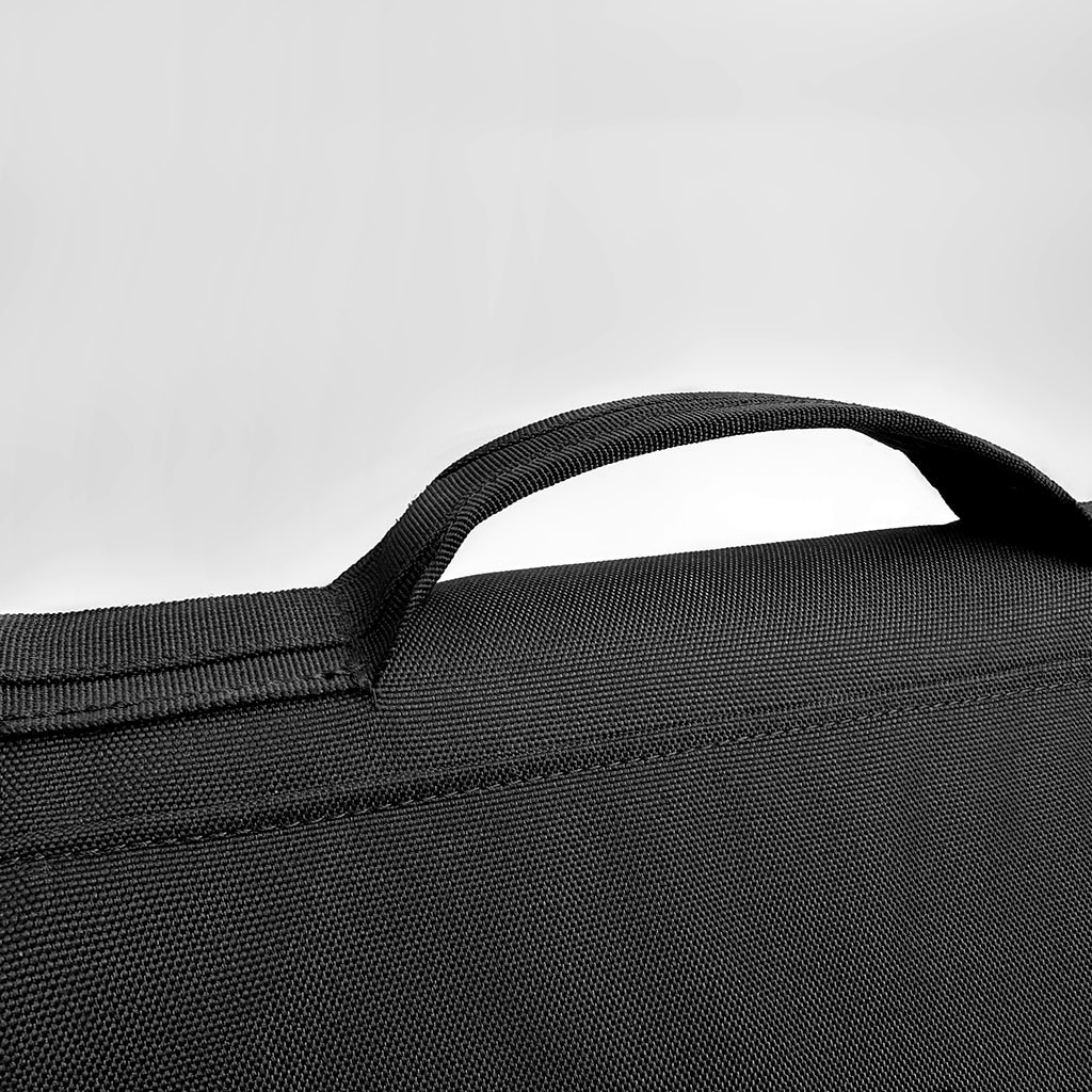 Detail of the ergonomic, comfortable top handle of the Urban Defender Covert Ballistic Briefcase, designed for professional daily carry.