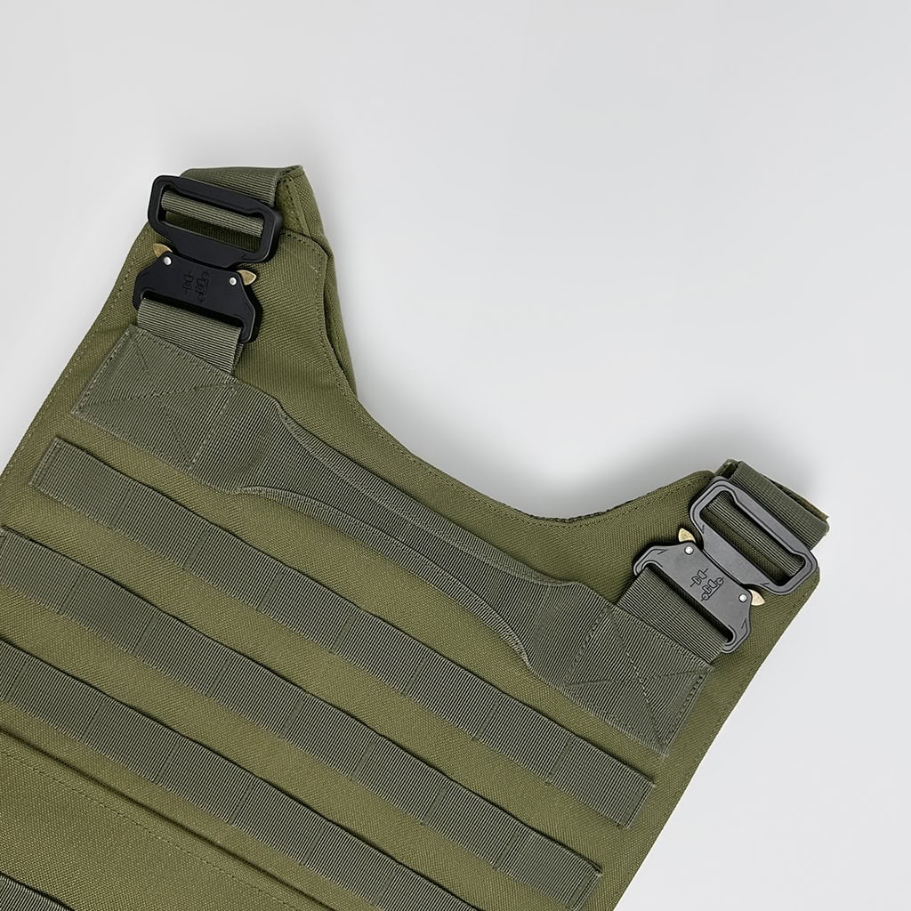 Detail of the "Praetorian" armor's padded shoulder strap with a heavy-duty quick-release Cobra-style buckle for emergency doffing.
