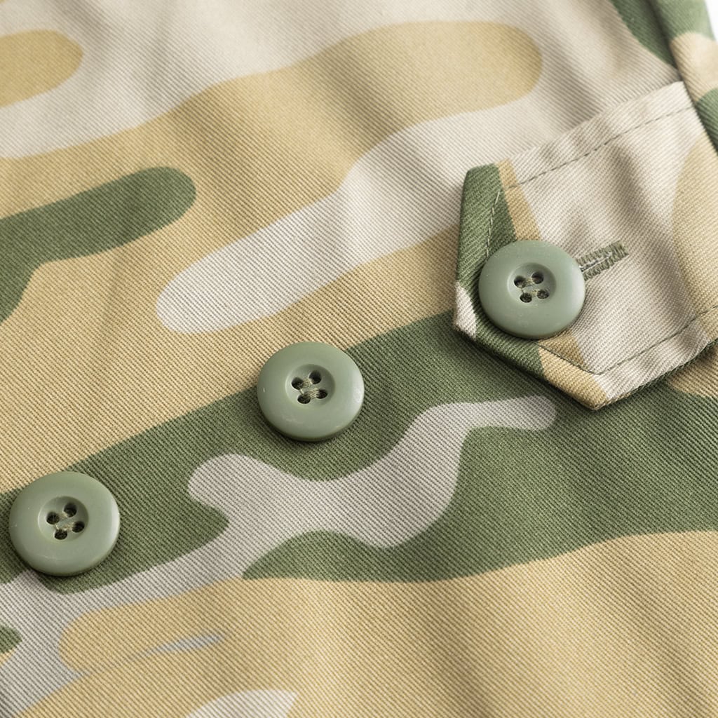 Close-up of the button-flapped bellowed breast pocket on the "Savanna" Jungle Camo BDU jacket, providing secure storage for gear.