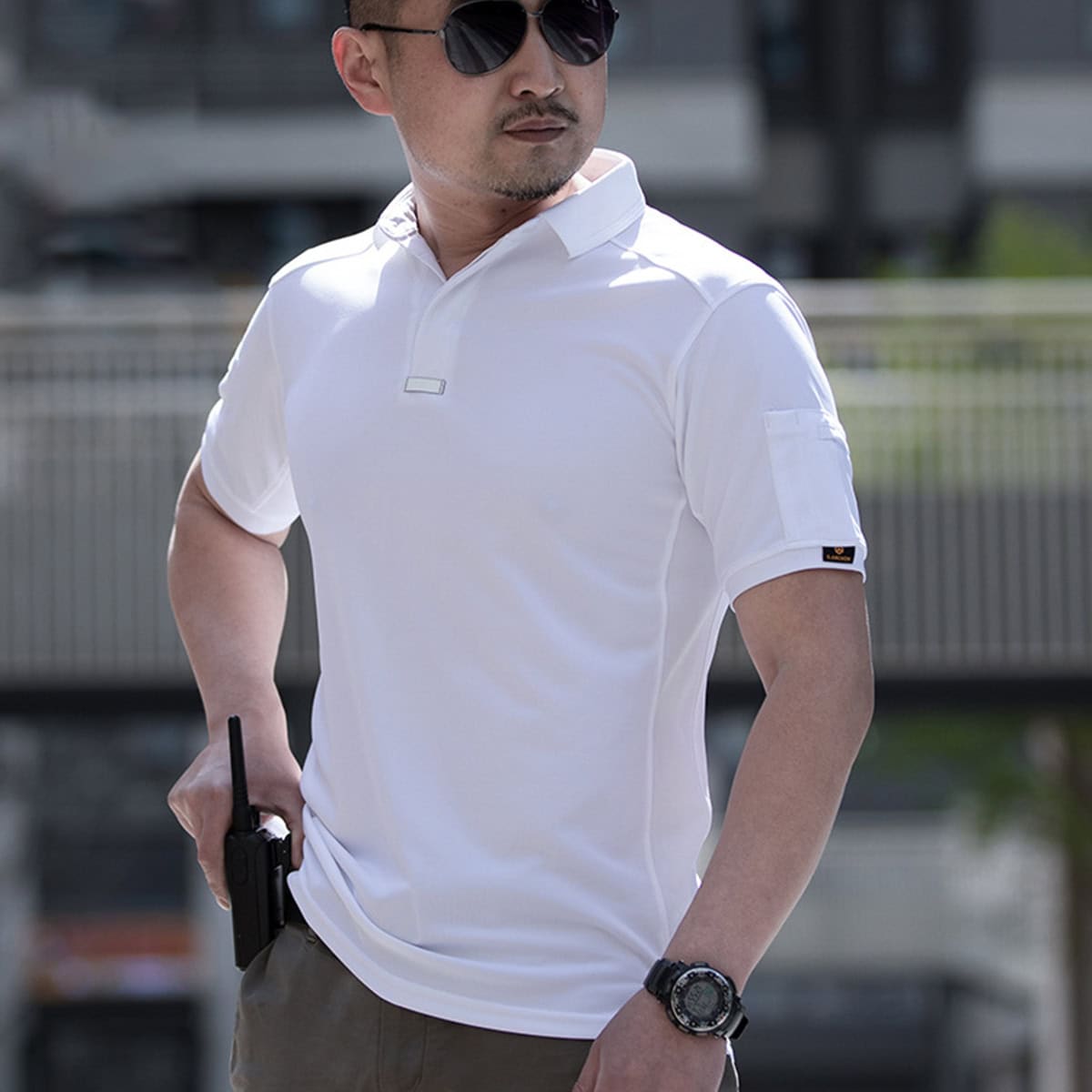 Plainclothes officer wearing the white CMAX moisture-wicking tactical polo, showcasing its suitability for covert or plainclothes duty.