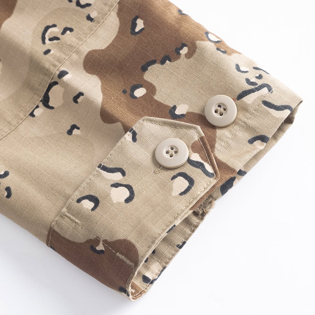 Detail of the adjustable buttoned cuff on the Desert Camo BDU jacket, designed for a secure fit.