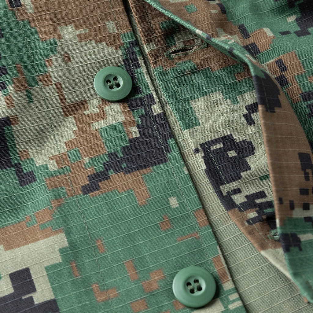 Detail of the adjustable buttoned cuff on the ACU Combat Uniform jacket for a secure fit.