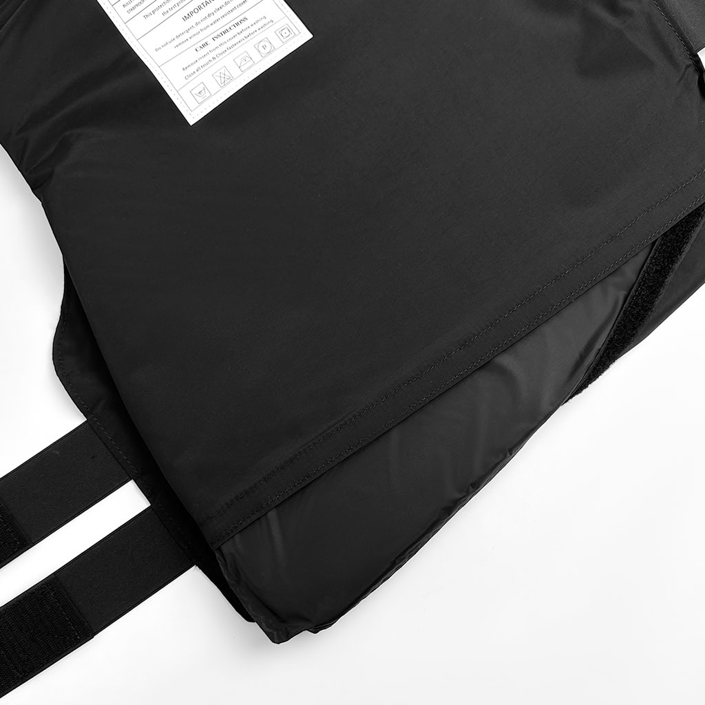 Detail showing the lightweight and flexible NIJ IIIA soft armor panel being inserted into the concealable body armor carrier.