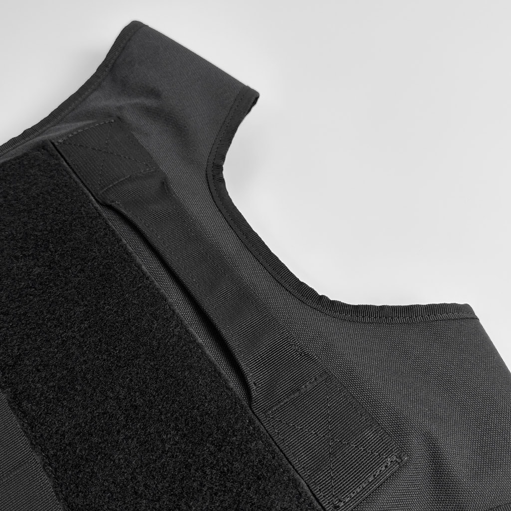 Close-up of the heavy-duty, adjustable shoulder velcro strap on the Guardian MOLLE plate carrier, allowing for a secure and customized fit.