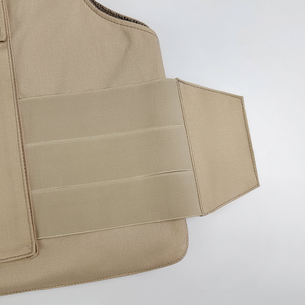 Close-up of the elasticated waist adjustment straps of the overt body armor vest, which provide a secure and flexible fit for all-day comfort.