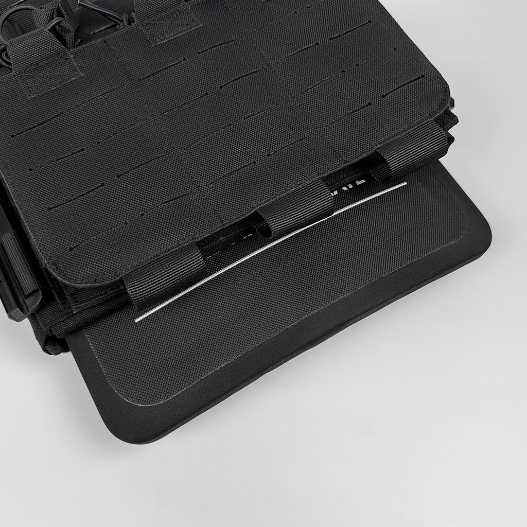 Detail of the Vanguard plate carrier's internal pocket, designed to securely hold hard armor protective plates for military and SWAT use.