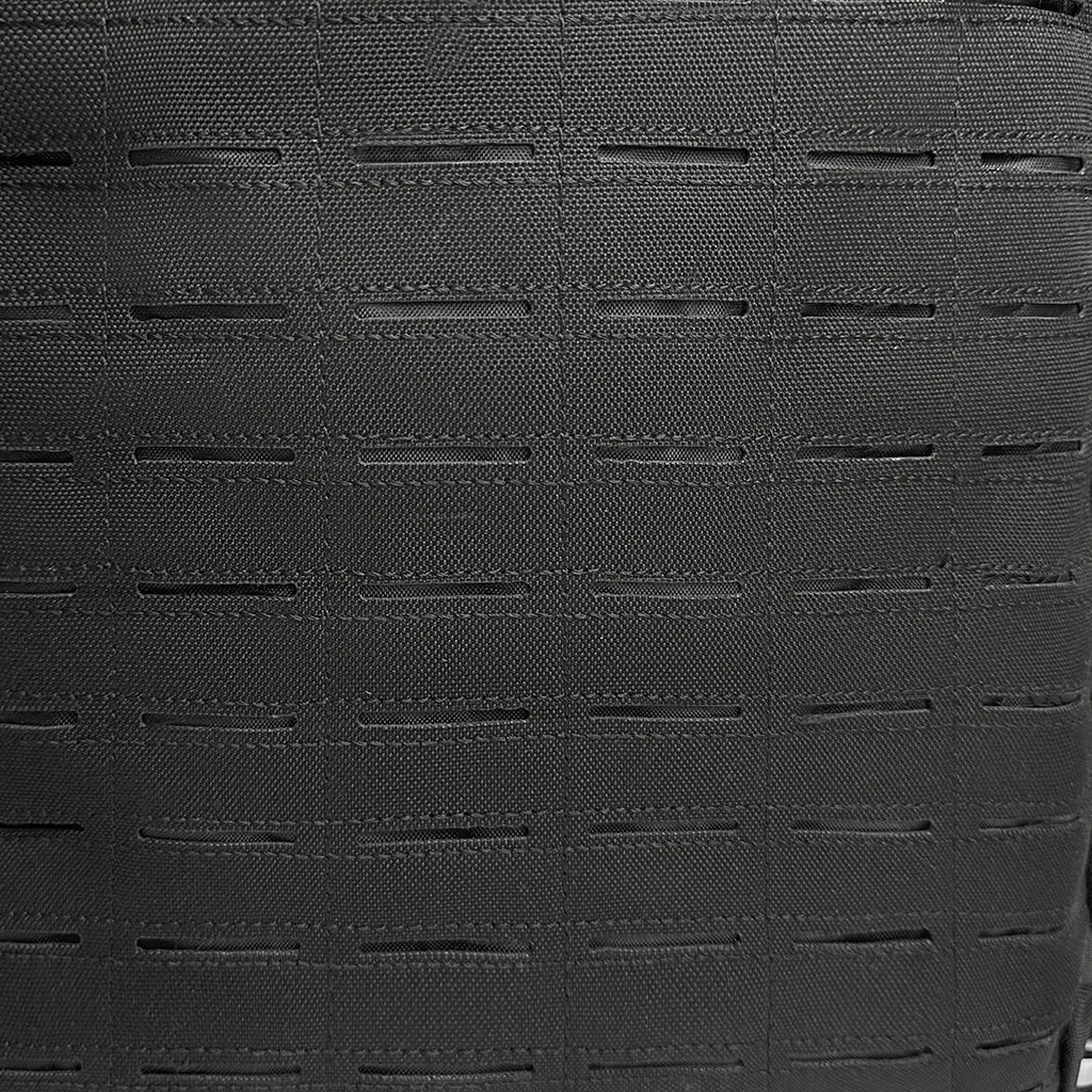 Close-up of the modern, laser-cut MOLLE system on the "Ghost" covert tactical backpack, providing a lightweight, snag-free platform.