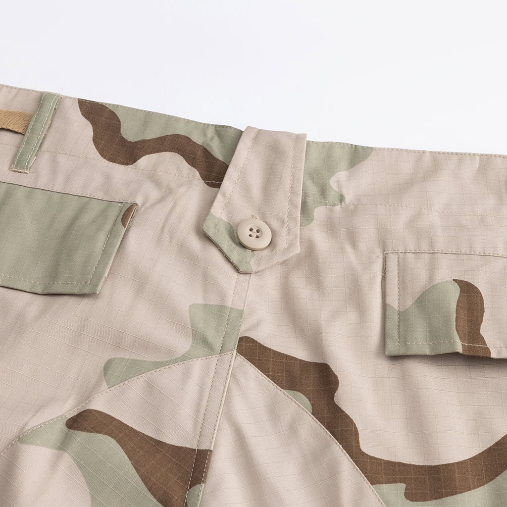Close-up of the durable waistband and button fly on the 3-Color Desert BDU trousers.