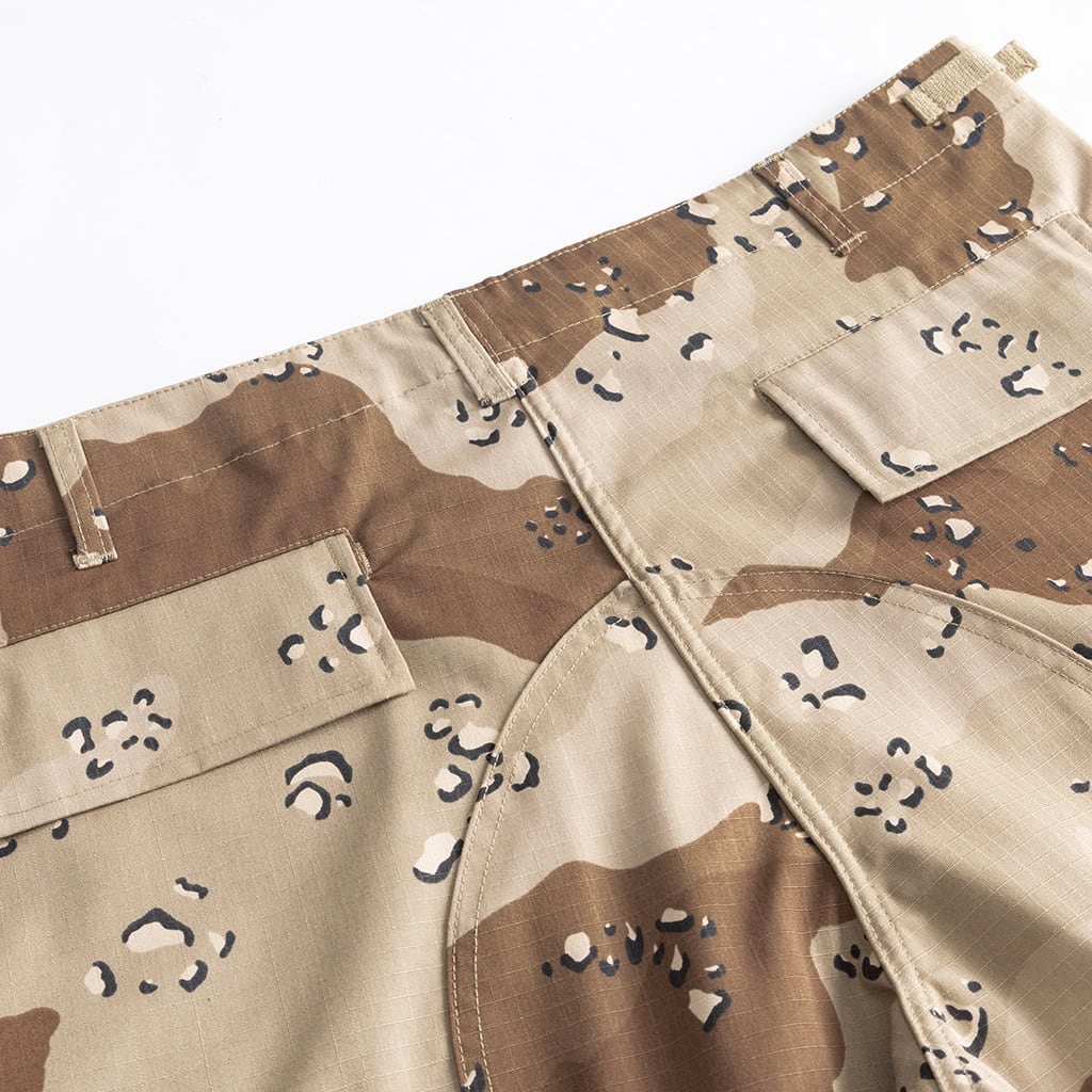 Close-up of the large, pleated cargo pocket on the Desert Camo BDU trousers, providing ample storage.