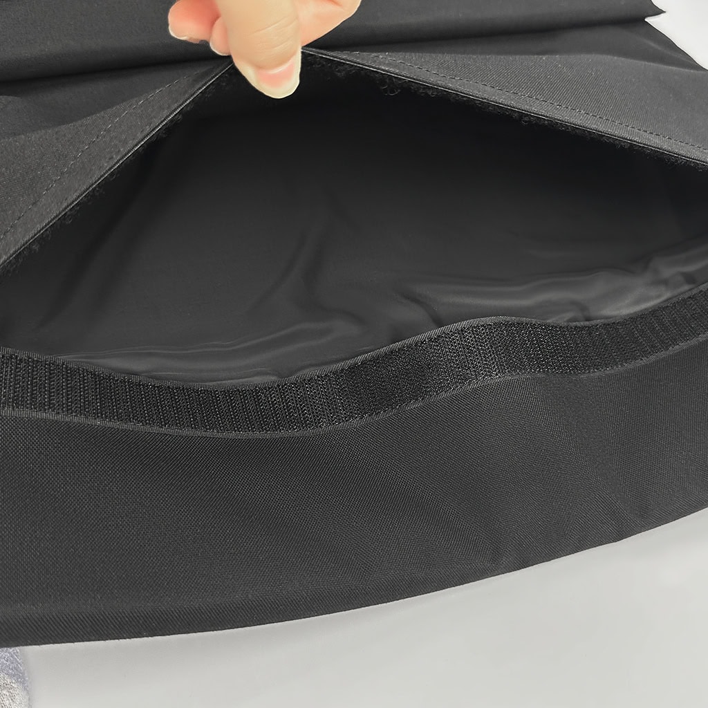 Detail of the interior compartment of the ballistic briefcase, showing the lightweight, flexible NIJ IIIA soft armor panel that provides protection.