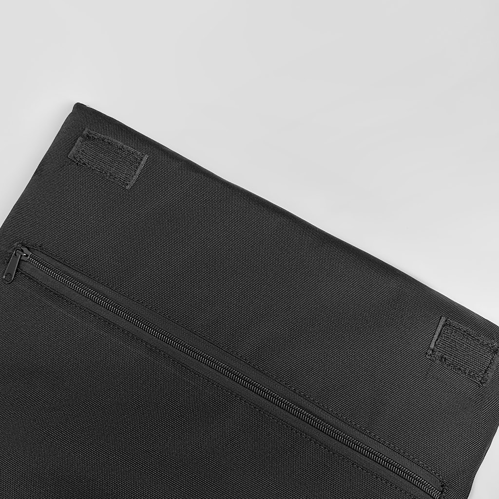 Detail of the interior compartment of the ballistic briefcase, showing the zippered pocket for the lightweight, flexible NIJ IIIA soft armor panel.