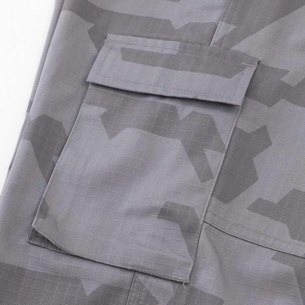 Close-up of the large, pleated cargo pocket on the Urban Camo ACU trousers, providing ample storage.