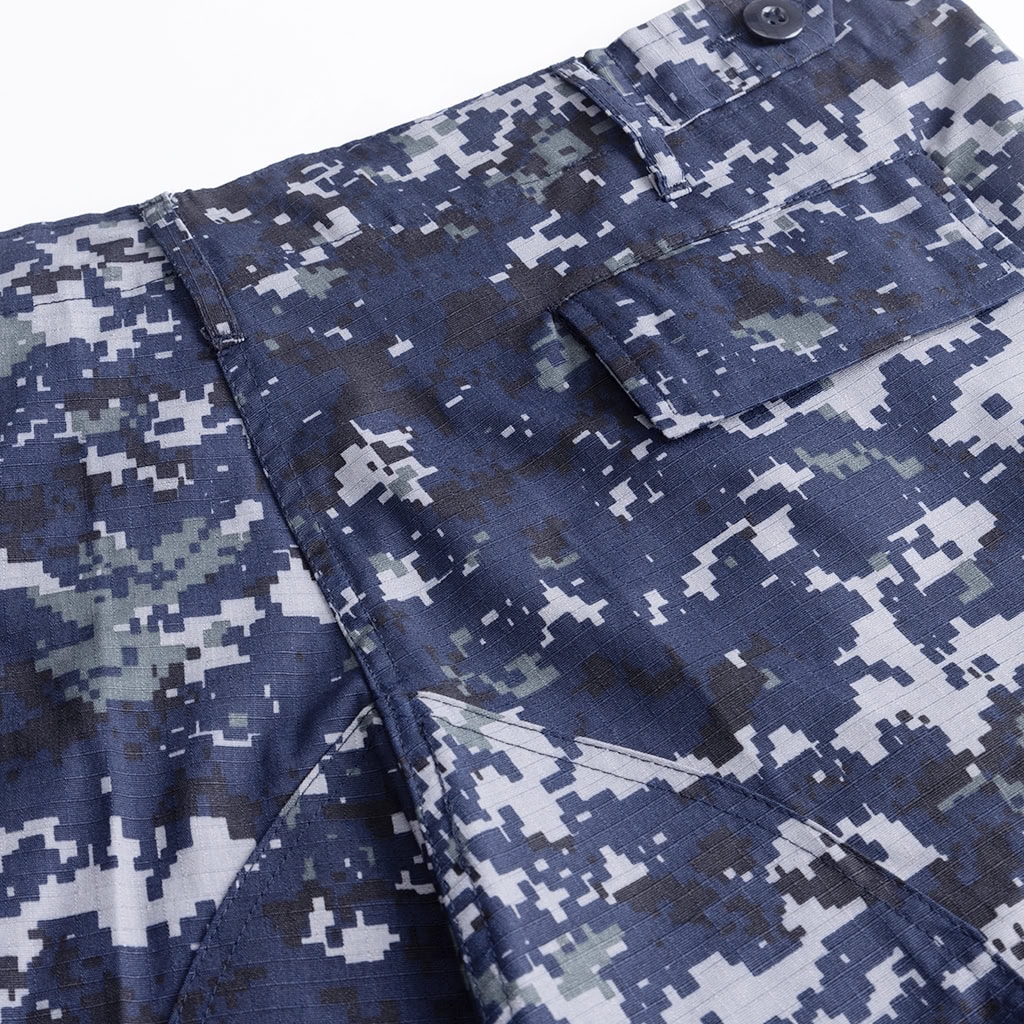 Close-up of the large, pleated cargo pocket on the Naval Combat Uniform trousers.