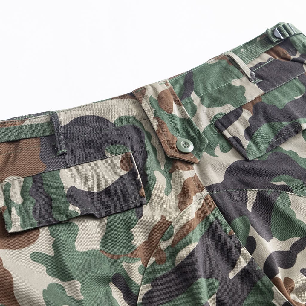 Close-up of the large, pleated cargo pocket on the Woodland Camo BDU trousers.