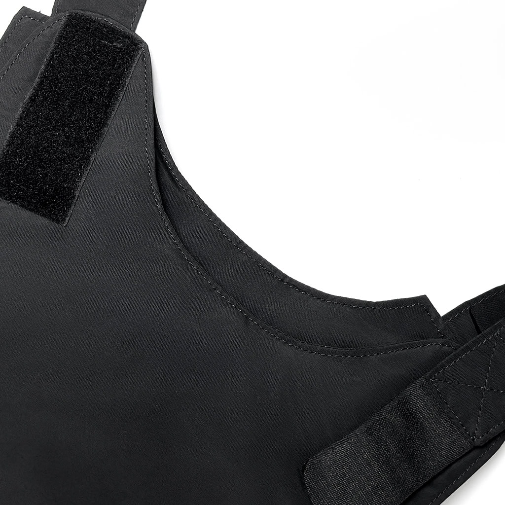 Close-up of the heavy-duty shoulder Velcro adjustment strap on the concealable body armor, allowing for a secure and customized fit.
