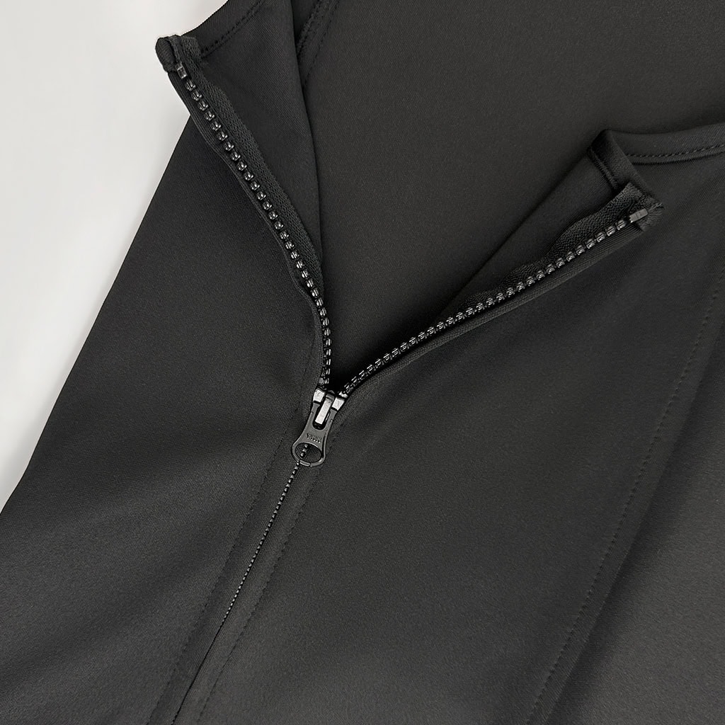 Close-up of the hidden side zipper on the deep concealment body armor, allowing for easy donning and a seamless front profile.