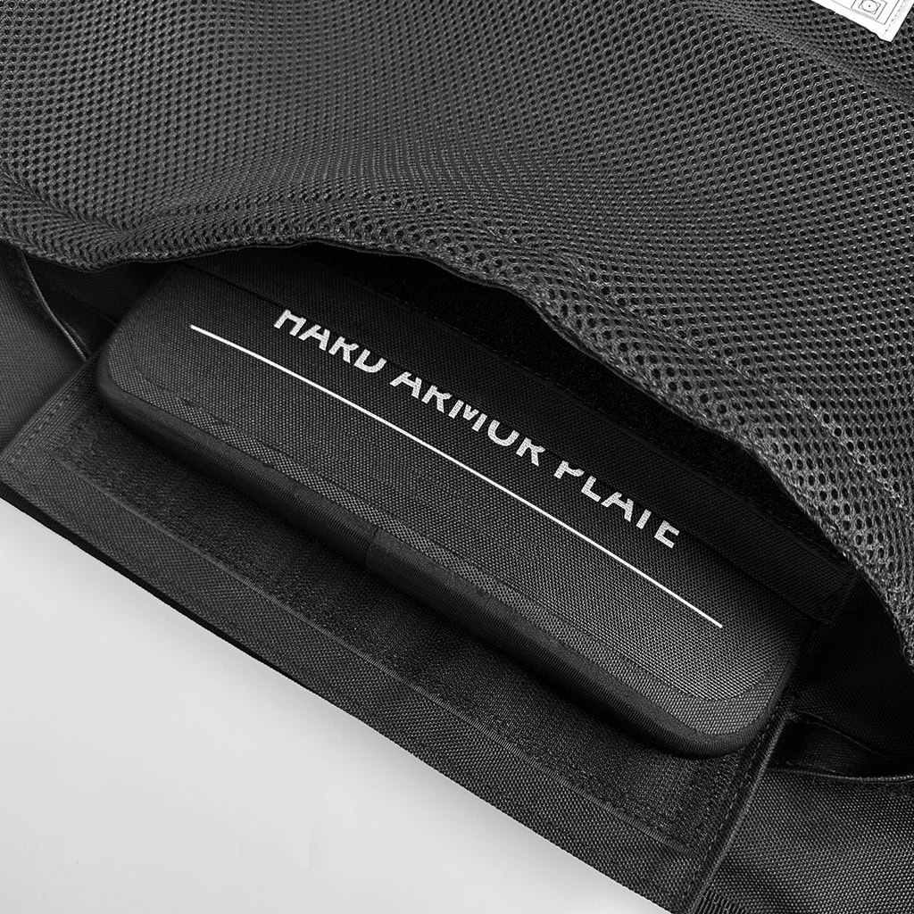 Detail showing the Guardian MOLLE plate carrier's internal pocket, compatible with both hard and soft armor plates for adaptable protection.