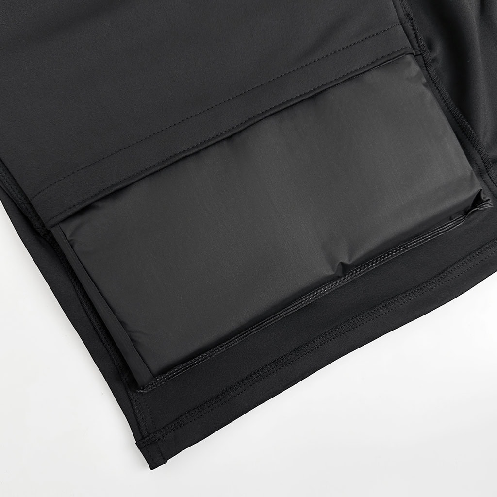 Detail showing the lightweight and flexible NIJ IIIA soft armor panel being inserted into the deep concealment armored t-shirt carrier.