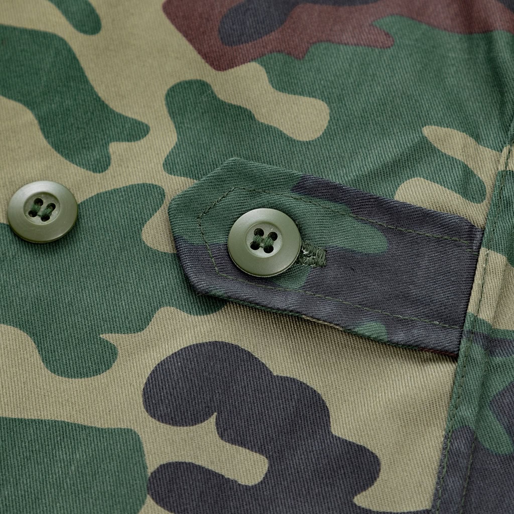 Close-up of the buttoned breast pocket flap on the custom jungle camo BDU uniform jacket.