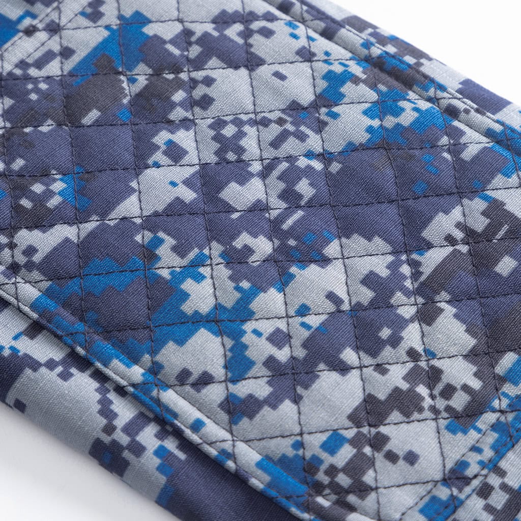 Detail of the unique quilted shoulder tab on the custom Malaysian blue digital camo uniform jacket.