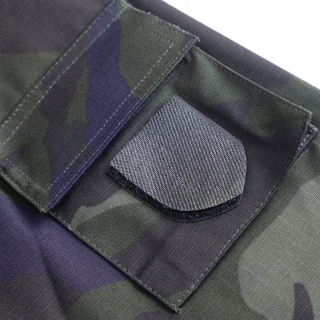 Close-up of the velcro patch and breast pocket on the custom Malaysian camo security uniform jacket.