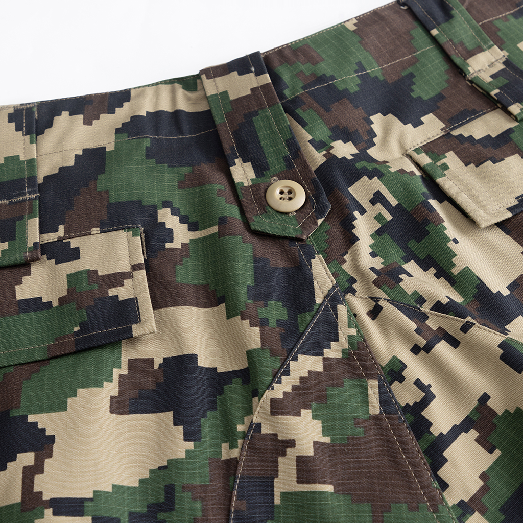 Close-up of the button-fly and waist construction on the custom jungle digital combat uniform trousers.