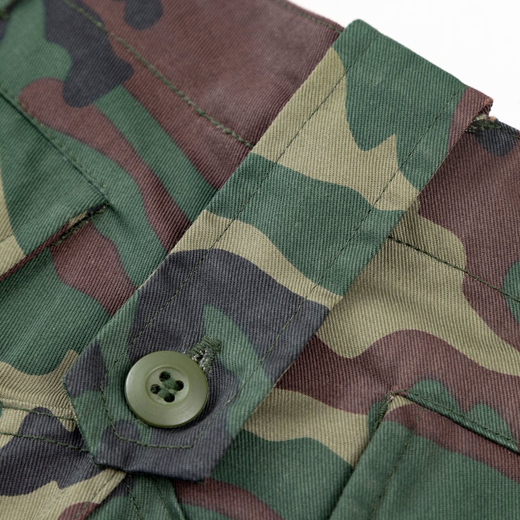 Detail of the adjustable waist tab on the custom jungle camo BDU uniform trousers for a secure fit.