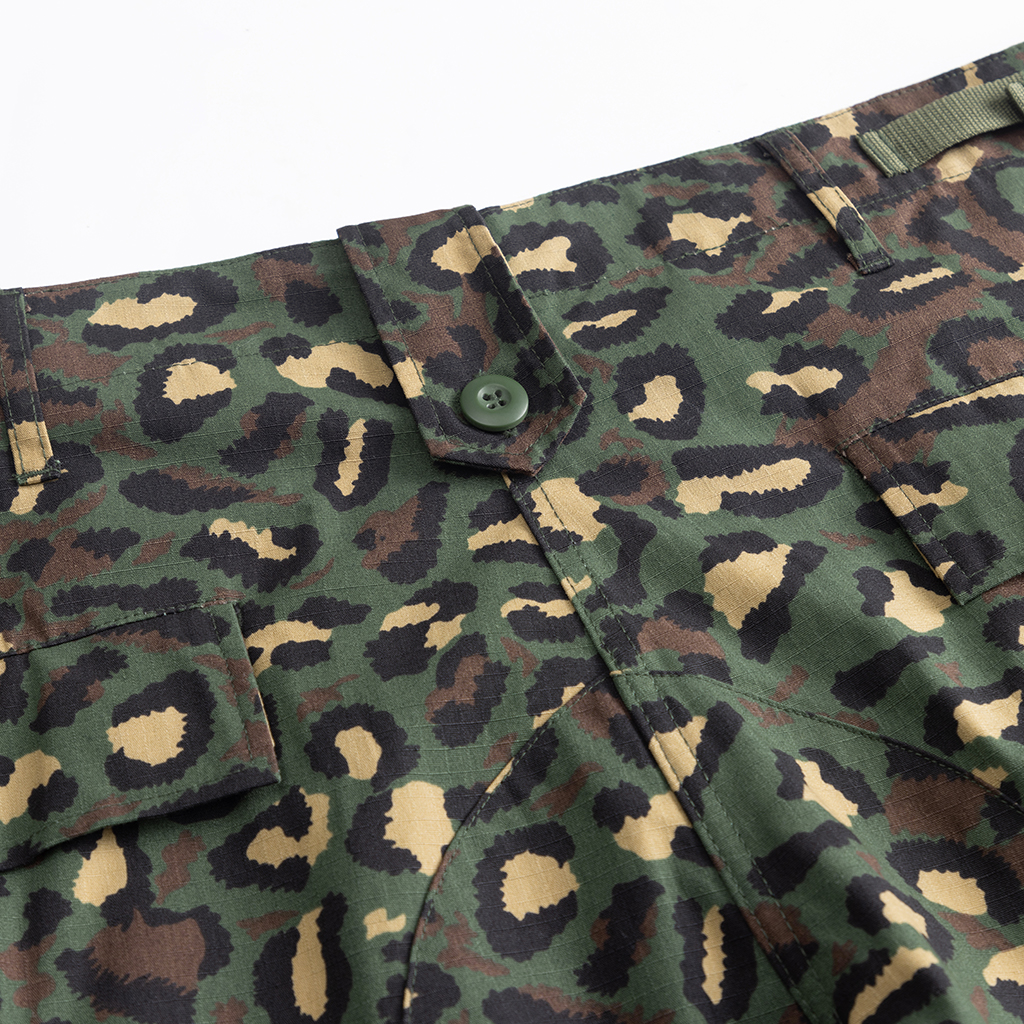 Close-up of the button-fly and waistband construction on the custom leopard camo BDU uniform trousers.