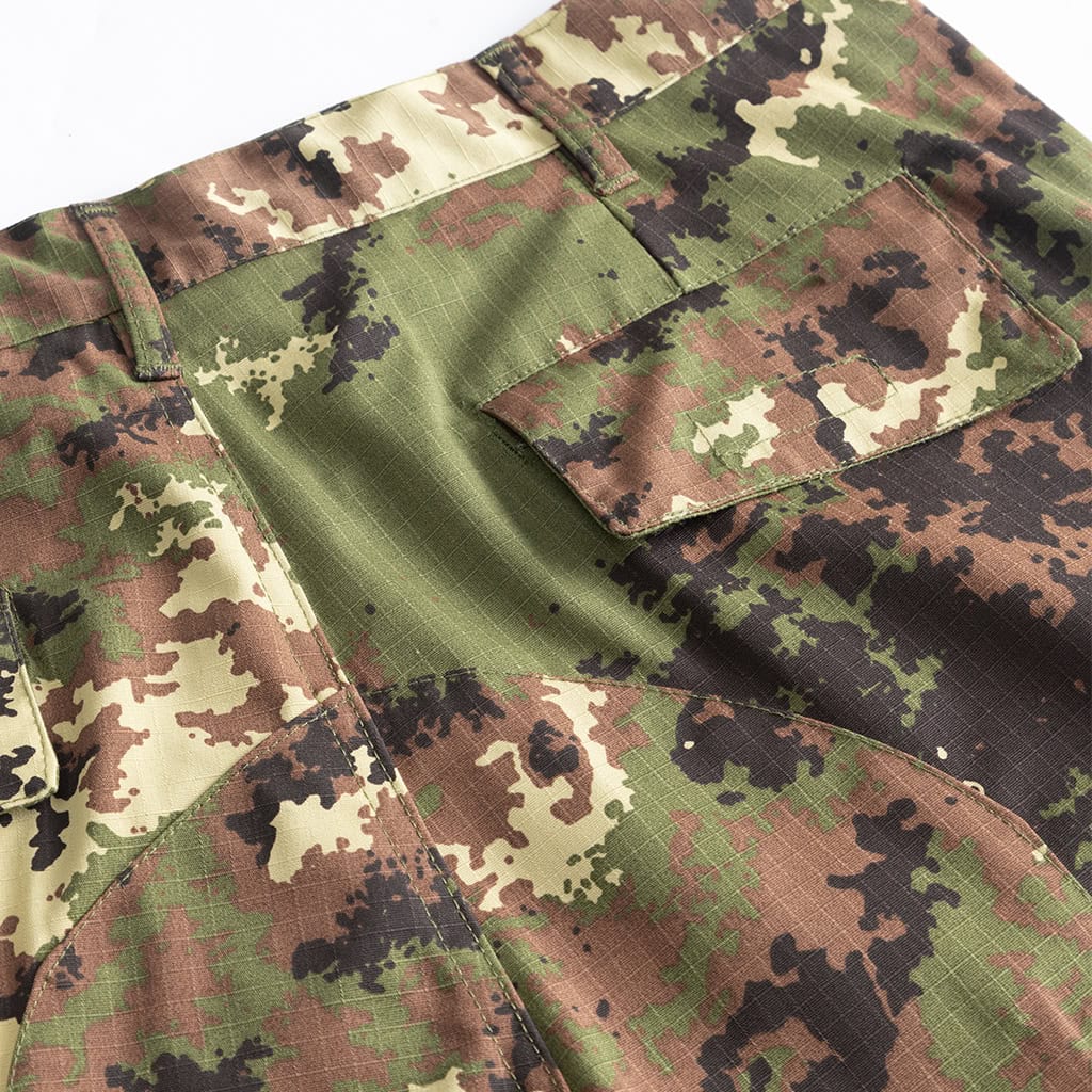 Close-up of the slant pocket and waistband on the custom Italian vegetato combat uniform trousers.