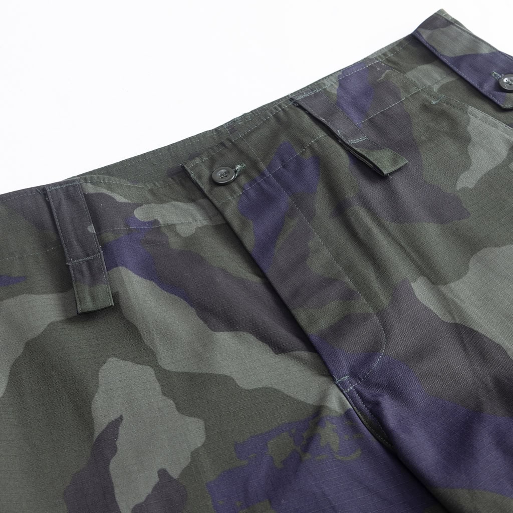 Close-up of the button-fly and waist construction on the custom Malaysian camo security uniform trousers.