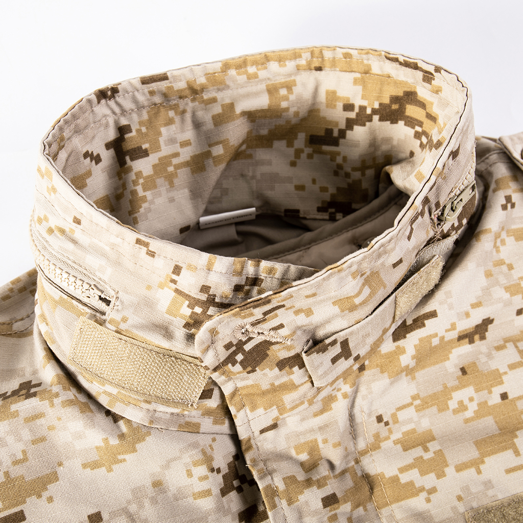 Close-up of the round collar with velcro and button closures on the custom digital desert M65 field jacket.