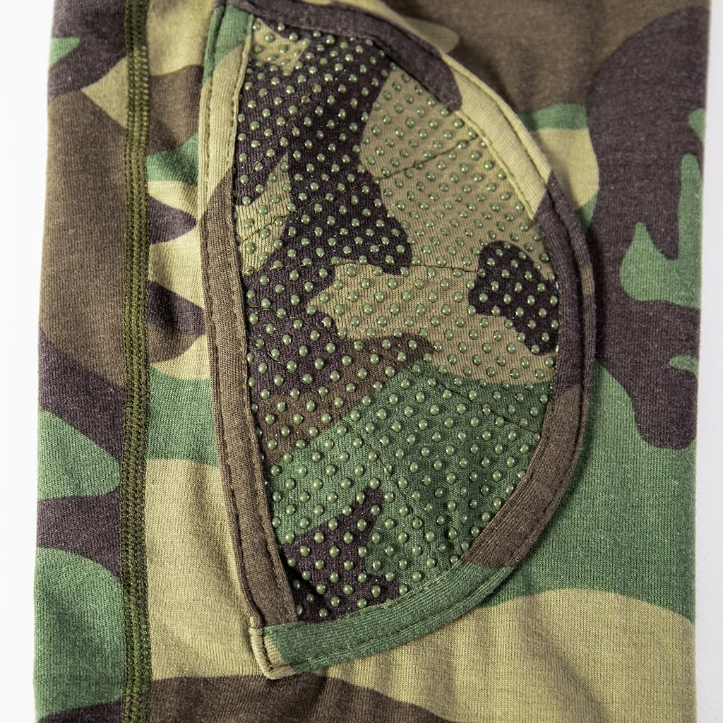 Close-up of the integrated anti-slip elbow pad on the sleeve of the custom woodland camo G4 combat shirt.