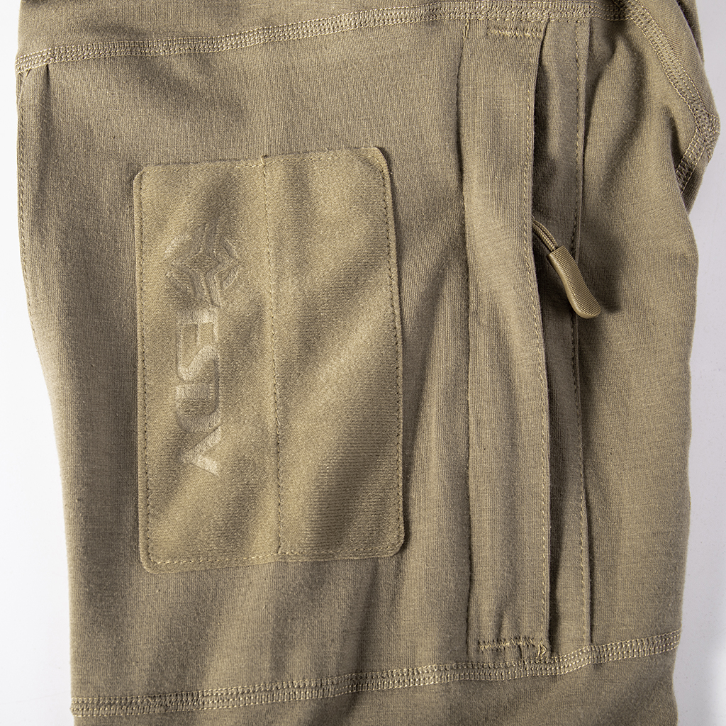 Detail of the zippered arm pocket with velcro panel on the sleeve of the custom khaki G4 long sleeve combat shirt.
